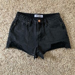 black ripped midrise shorts